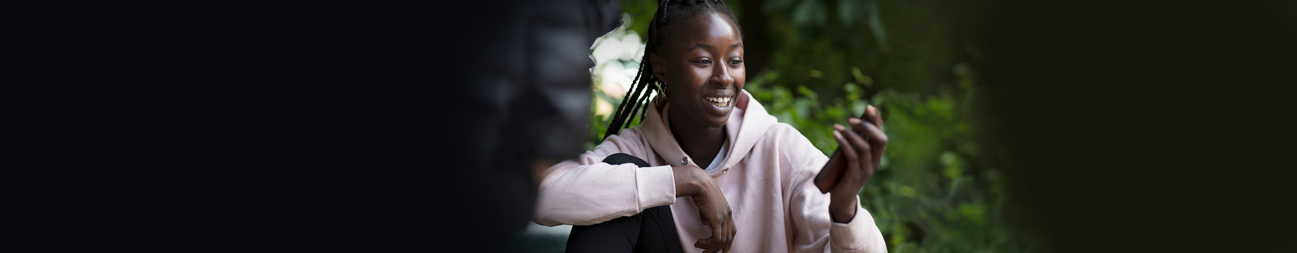 Smiling girl with a mobilephone